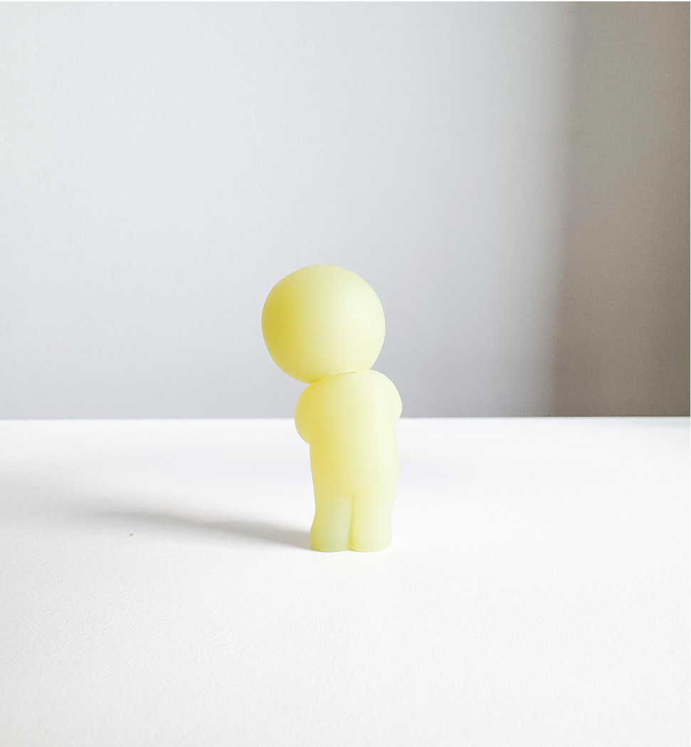 Image of Smiski figurine, from the back view.