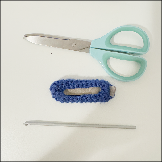 Conductive fabric is cut to the shape of the petal and placed inside of the petal.